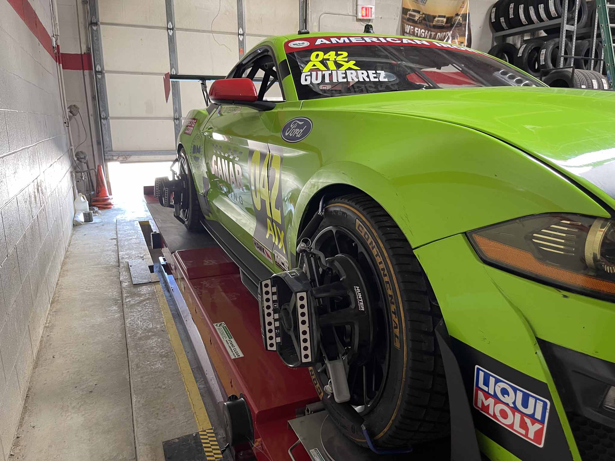 Race car on the alignment rack at Atomic Autosports in Wickliffe, Ohio during off-season setup work