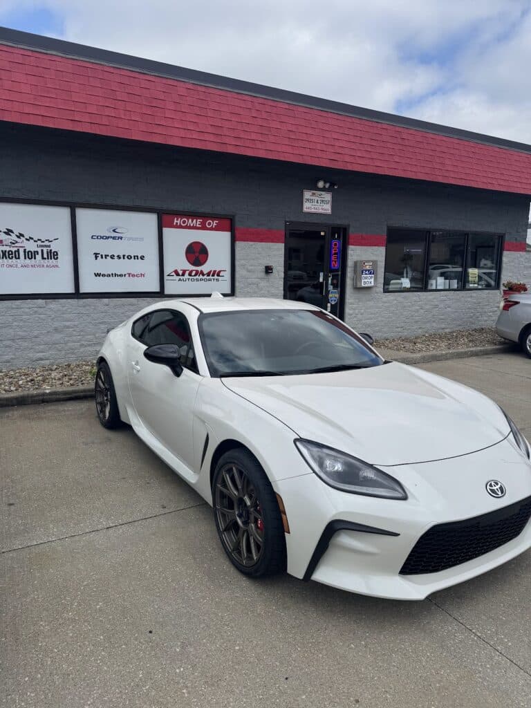 2024 Toyota GR86 with big brake kit and tires installed at Atomic Autosports for performance upgrades.