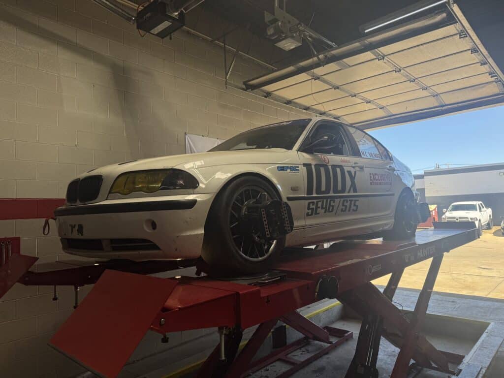 2001 BMW 330i undergoing precision alignment at Atomic Autosports.