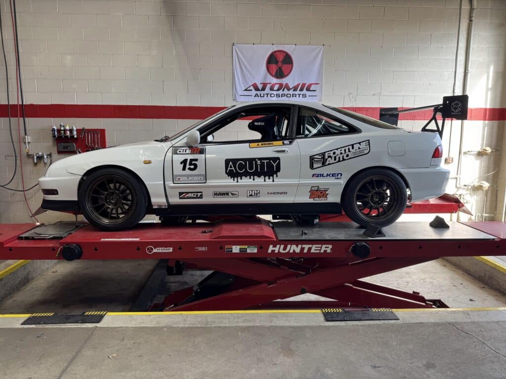 1998 Acura Integra undergoing alignment service at Atomic Autosports.