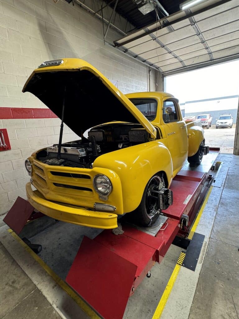 1956 Studebaker E14 with LS swap receiving alignment service at Atomic Autosports.