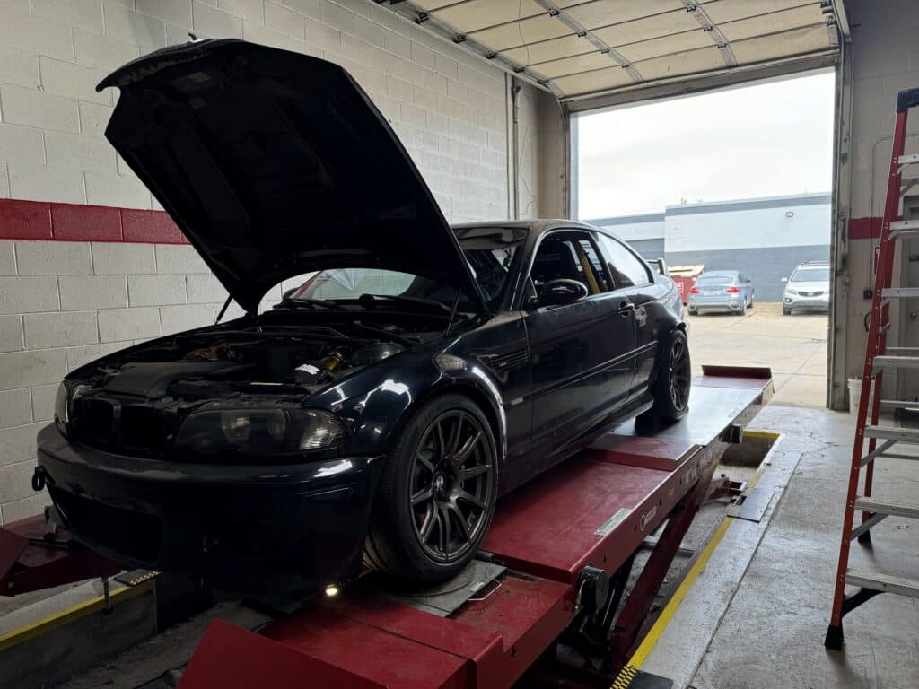 2004 BMW M3 undergoing alignment service at Atomic Autosports.