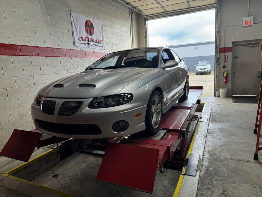 2006 Pontiac GTO on the alignment rack at Atomic Autosports.
