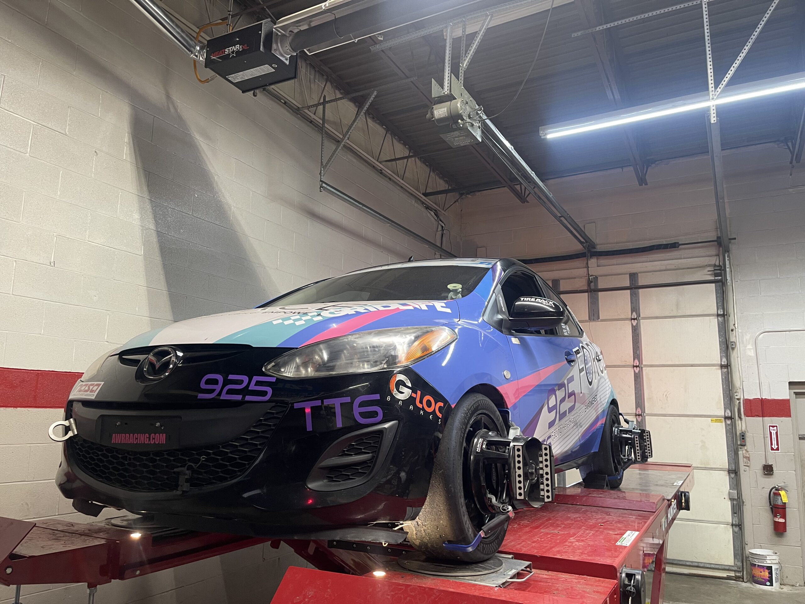 2013 Mazda 2 B-Spec race car competition action