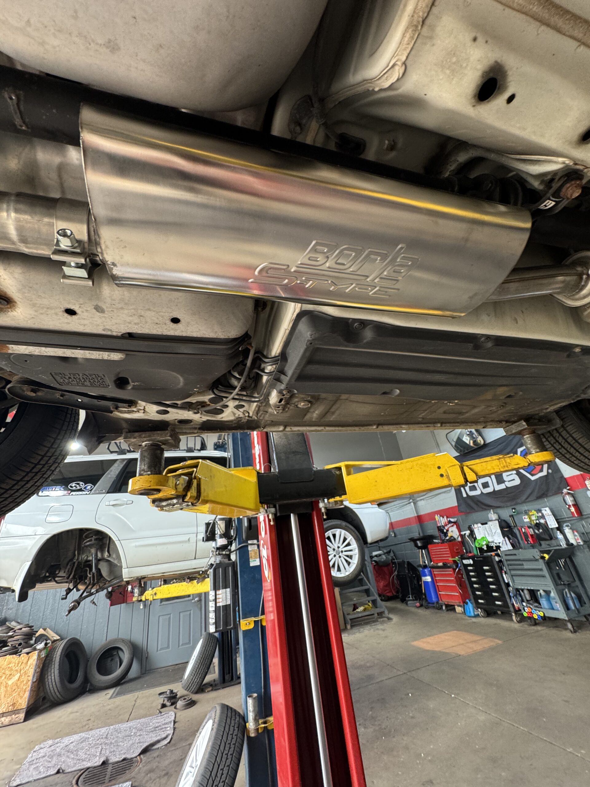 Borla S-Type muffler installed under a 2013 Scion FR-S at Atomic Autosports
