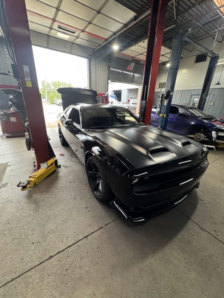 2022 Dodge Challenger Hellcat with a differential brace, new tires, and beadlock wheels at Atomic Autosports.